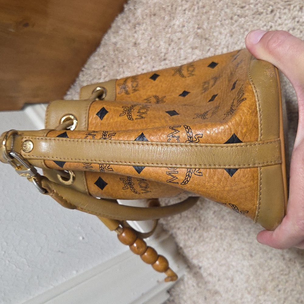Authentic MCM Visetos Coated Canvas Heritage
Drawstring Bucket Bag Cogna… - Picture 6 of 15